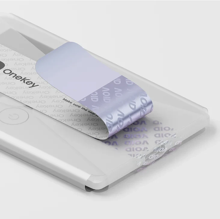 OneKey’s illustration of a peeled seal leaving VOID marks on the white Classic 1S Pure wrapping.