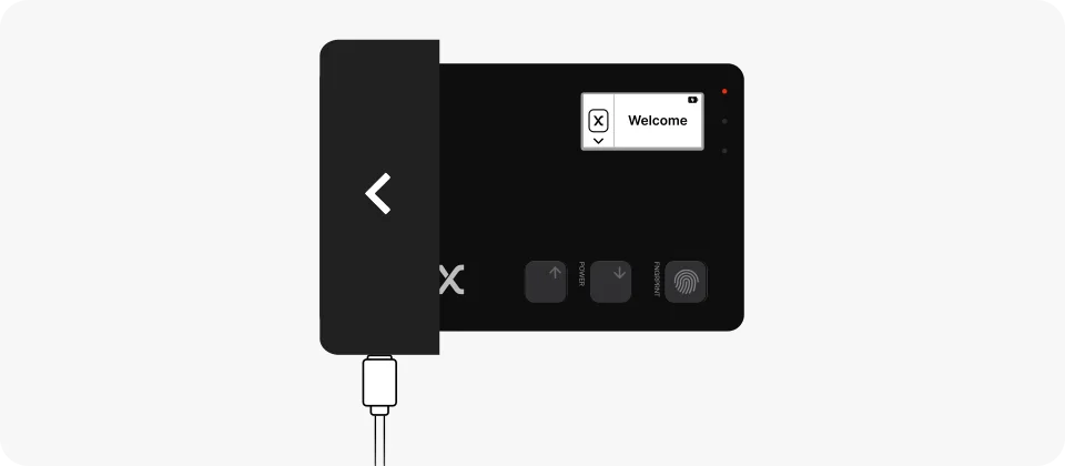 Manufacturer illustration of Shield BIO inserted into its charging dock, with a cable connected to the dock and a red indicator on the card.